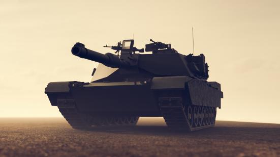 Battle tank silhouetted at dusk