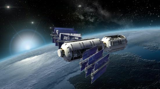 Spacecraft with solar arrays in orbit above Earth
